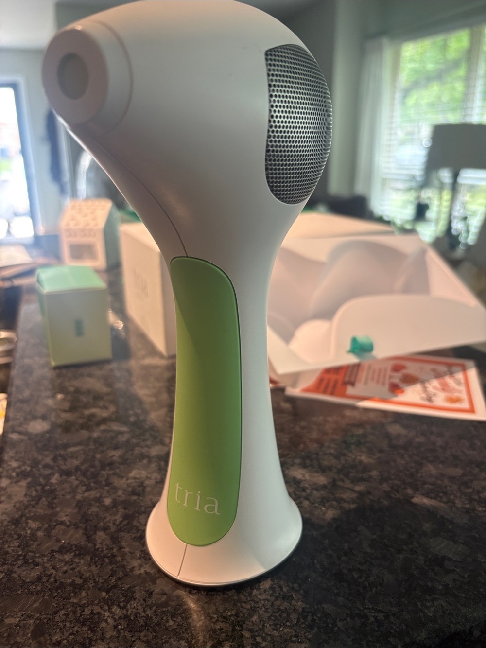 White and Light Green Portable Handheld Treatment Device